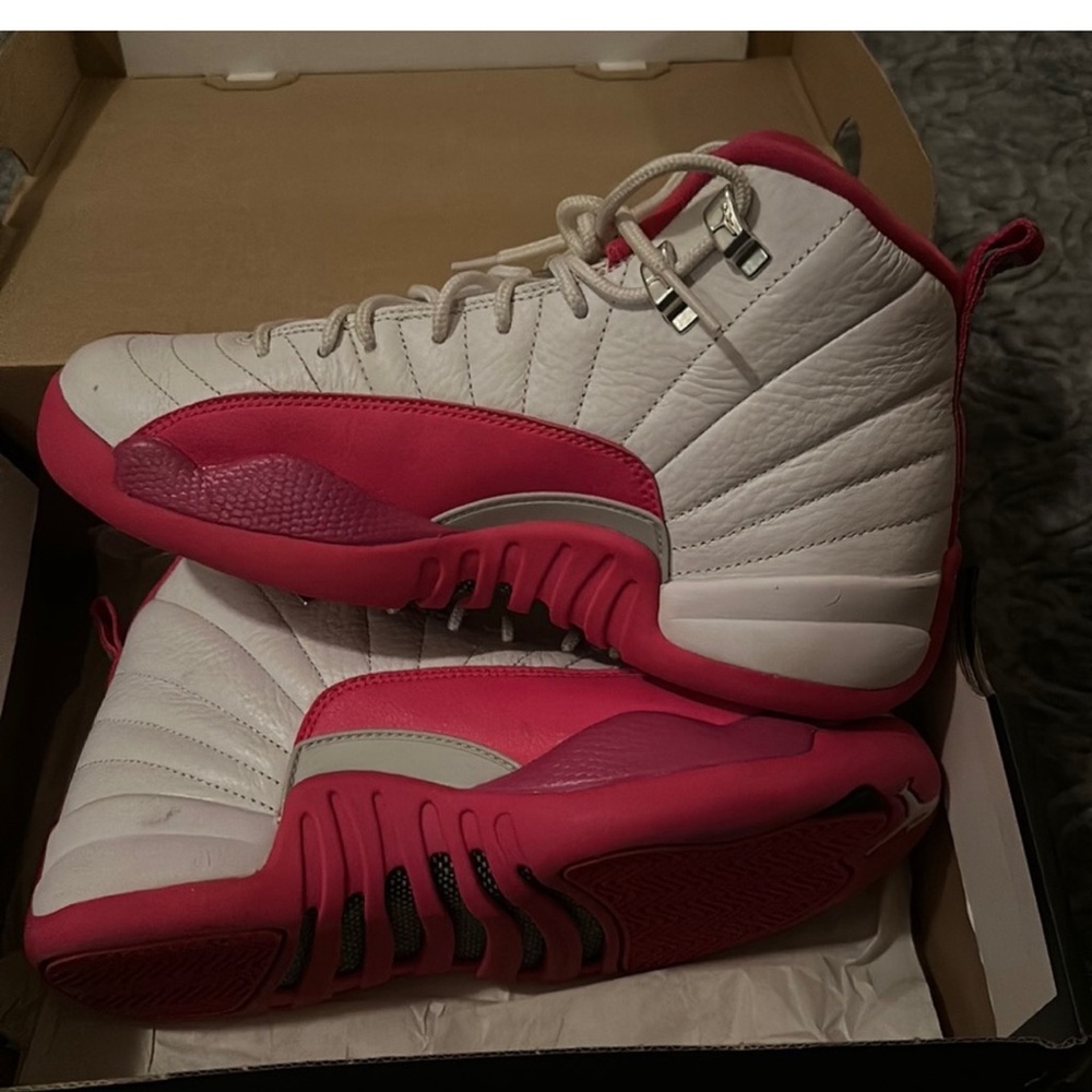 Pink and white Jordan’s 12s